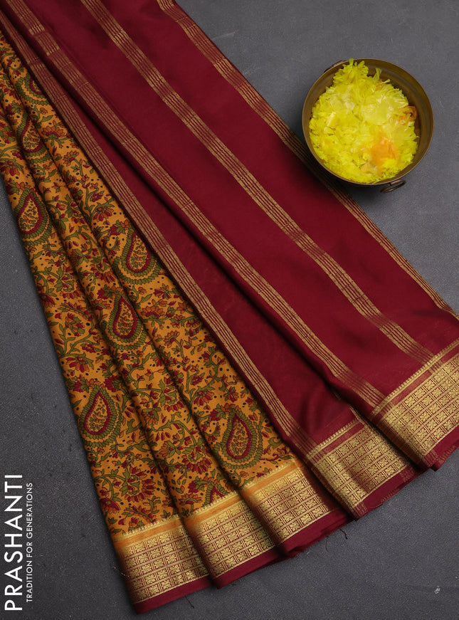 Semi mysore silk saree sandal and deep maroon with allover prints and small zari woven border