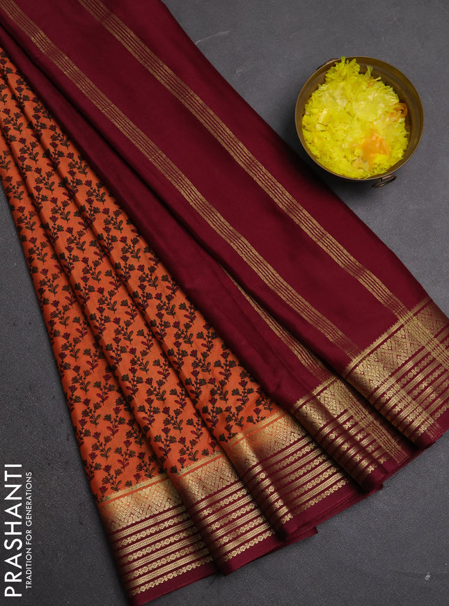 Semi mysore silk saree orange and deep maroon with allover floral prints and zari woven border