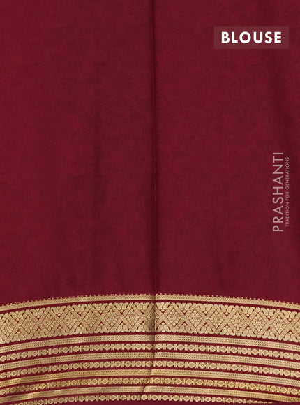 Semi mysore silk saree orange and deep maroon with allover floral prints and zari woven border