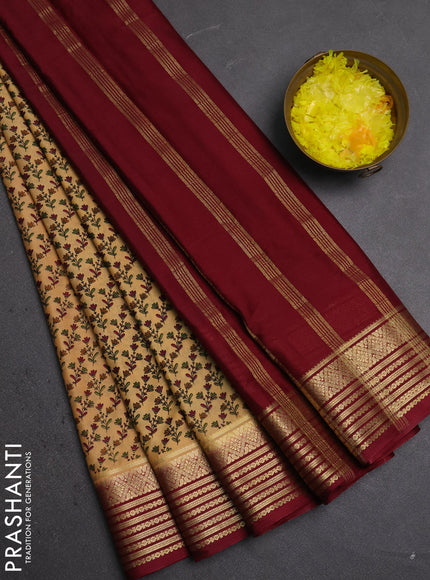 Semi mysore silk saree sandal and deep maroon with allover floral prints and zari woven border