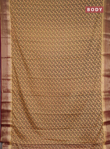 Semi mysore silk saree sandal and deep maroon with allover floral prints and zari woven border