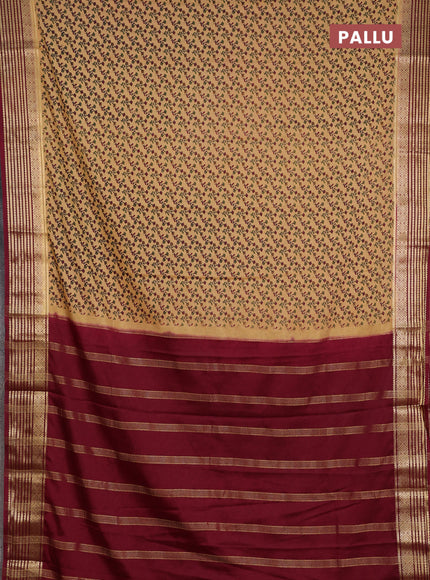 Semi mysore silk saree sandal and deep maroon with allover floral prints and zari woven border