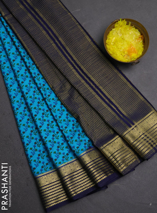 Semi mysore silk saree teal blue and navy blue with allover floral prints and zari woven border