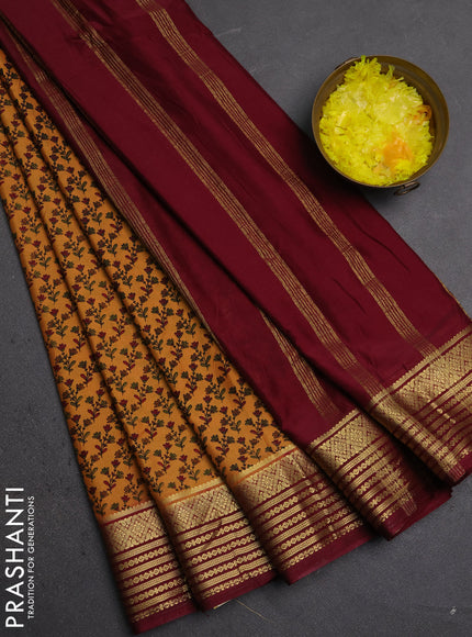Semi mysore silk saree sandal and deep maroon with allover floral prints and zari woven border