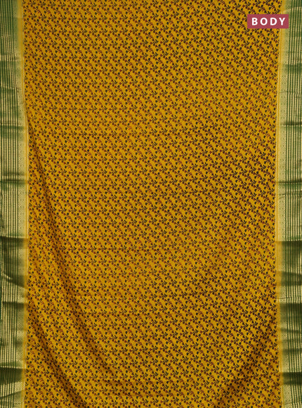 Semi mysore silk saree mustard yellow and green with allover floral prints and zari woven border
