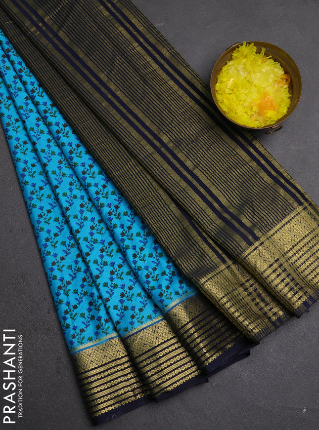Semi mysore silk saree teal blue and jamun shade with allover floral prints and zari woven border