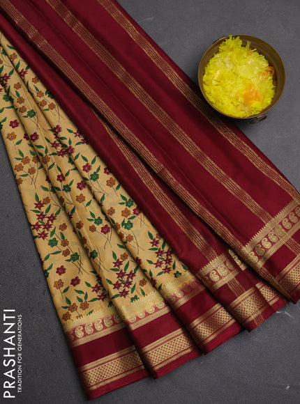 Semi mysore silk saree sandal and deep maroon with allover floral prints and rettapet zari woven border