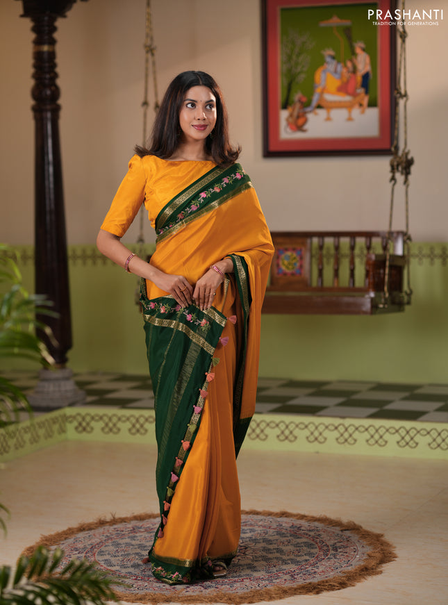 Pure mysore silk saree dark mustard and green with plain body and rettapet zari woven embroidery border