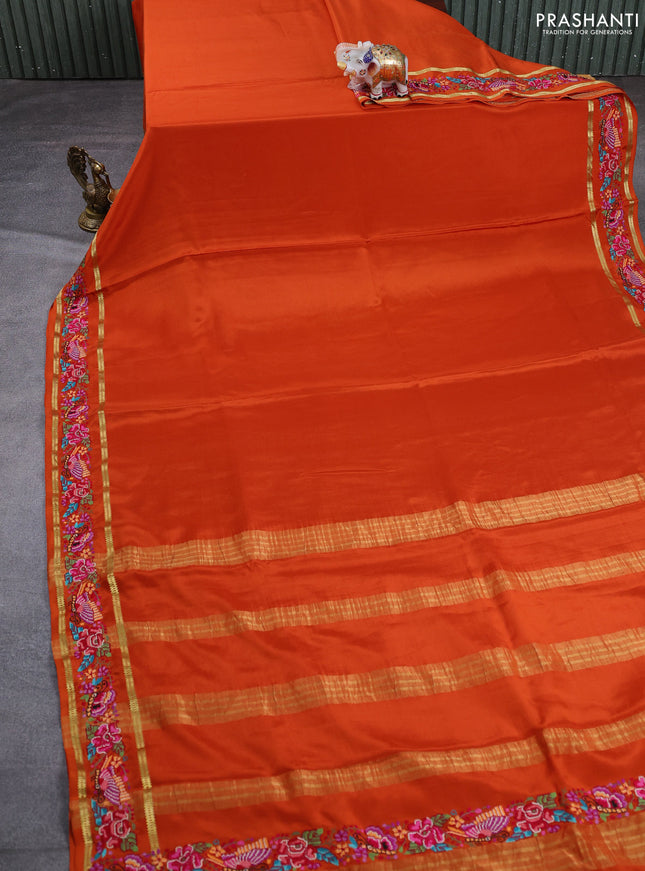 Pure mysore silk saree rust shade with plain body and rettapet zari woven embroidery border