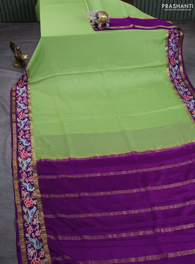 Pure mysore silk saree pista green and purple with plain body and rettapet zari woven embroidery border