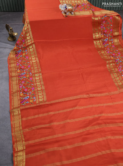 Pure mysore silk saree rust shade with plain body and long rettapet zari woven embroidery border