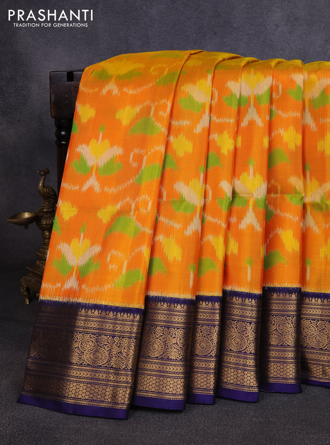 Ikat soft silk saree mango yellow and navy blue with allover ikat weaves and zari woven border