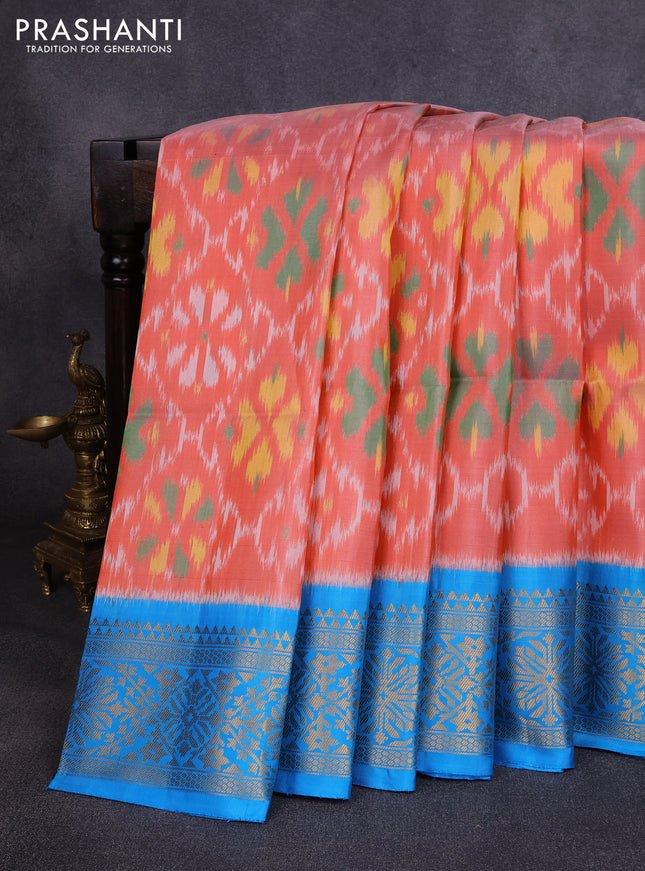 Ikat soft silk saree peach orange and cs blue with allover ikat weaves and zari woven border