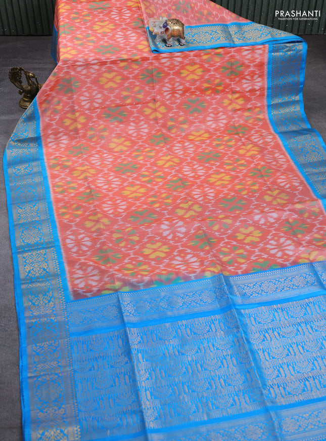 Ikat soft silk saree peach orange and cs blue with allover ikat weaves and zari woven border
