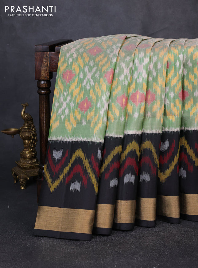 Ikat soft silk saree green and black with allover ikat weaves and long ikat zari woven border