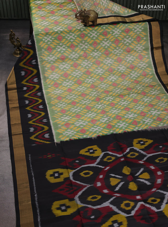 Ikat soft silk saree green and black with allover ikat weaves and long ikat zari woven border