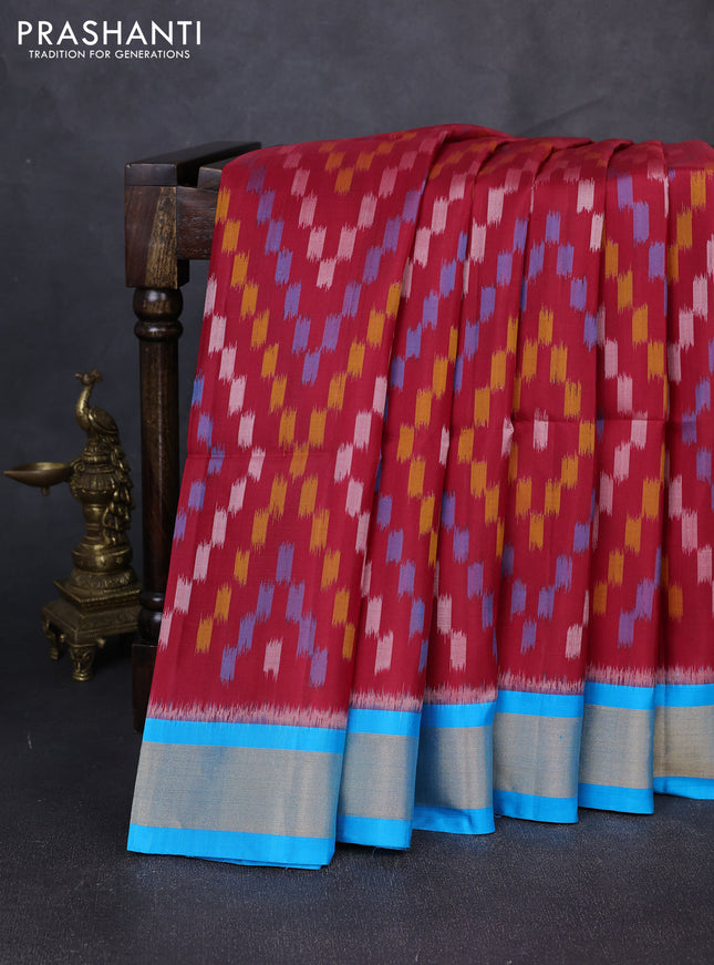 Ikat soft silk saree red and cs blue with allover ikat weaves and zari woven border