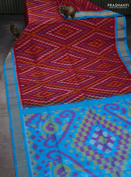 Ikat soft silk saree red and cs blue with allover ikat weaves and zari woven border