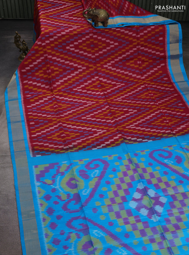 Ikat soft silk saree red and cs blue with allover ikat weaves and zari woven border