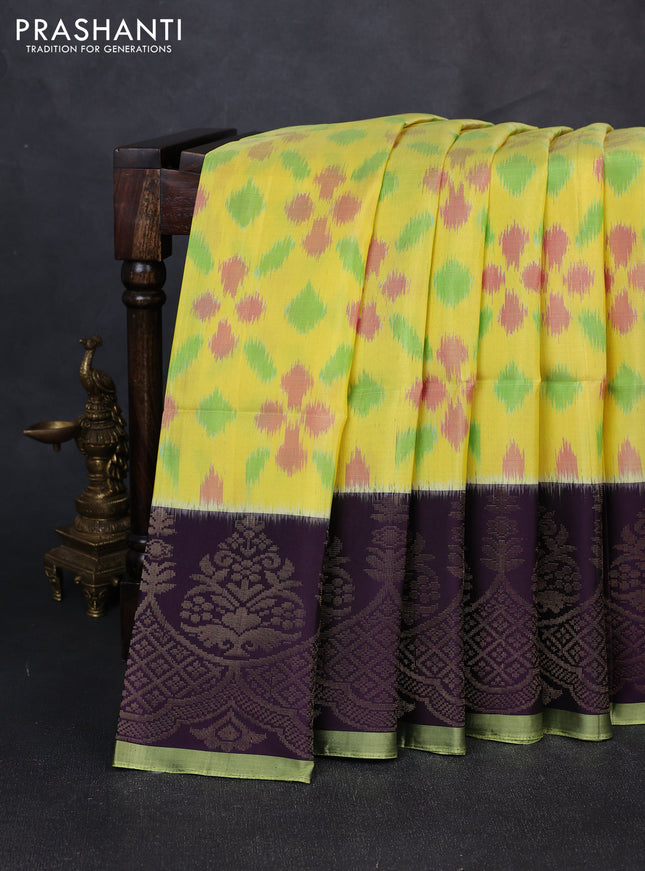 Ikat soft silk saree yellow and deep purple with allover ikat weaves and zari woven simple border