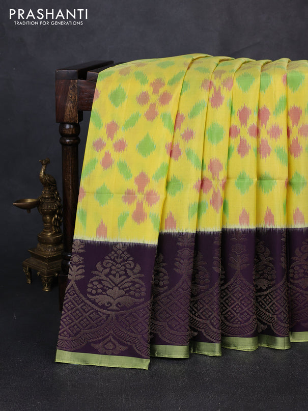 Ikat soft silk saree yellow and deep purple with allover ikat weaves and zari woven simple border