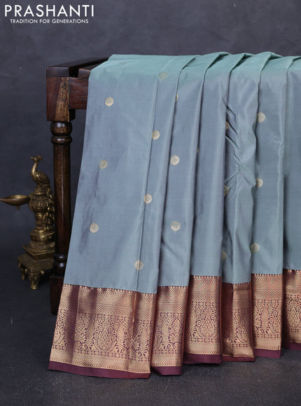 Bangalori silk saree pastel green and coffee brown with allover zari woven buttas and zari woven border