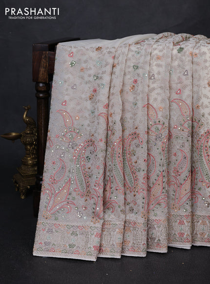 Georgette saree cream with allover embroidery & sequin work and embroidery stone work border