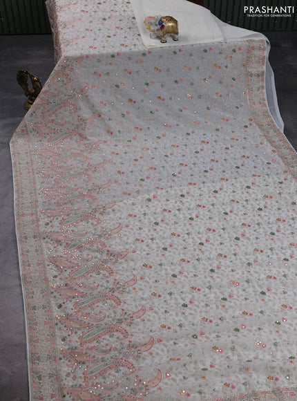 Georgette saree cream with allover embroidery & sequin work and embroidery stone work border