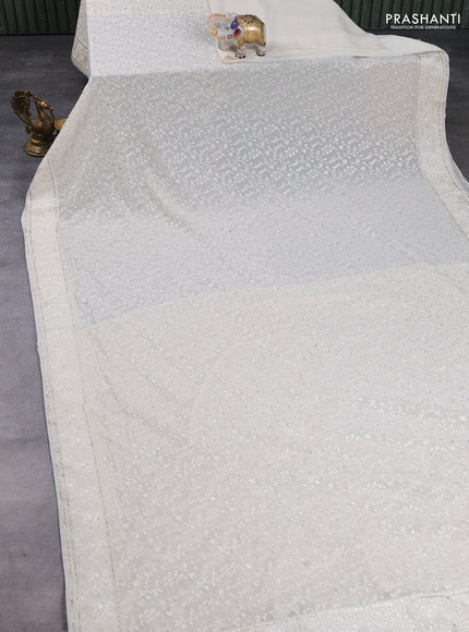 Georgette saree cream with allover embroidery & stone work