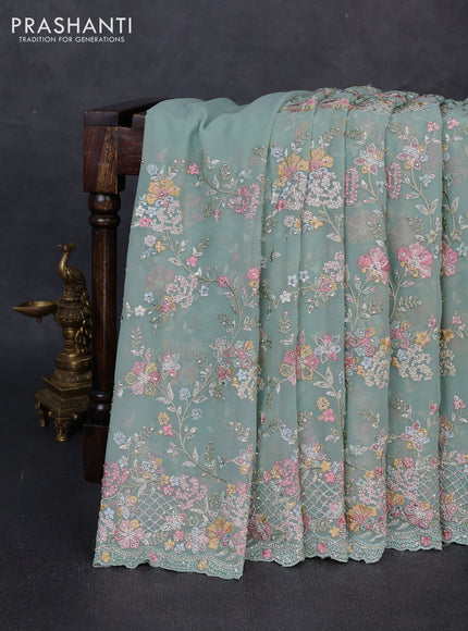 Georgette saree pastel green with allover embroidery & stone work