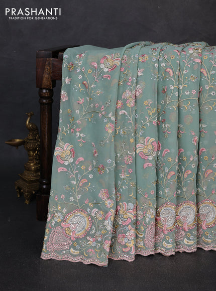 Georgette saree pastel green with allover embroidery & stone work