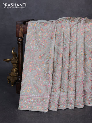 Georgette saree pastel green with allover embroidery & stone work