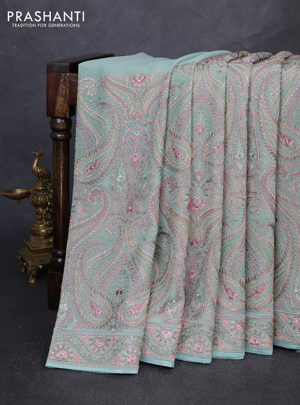 Georgette saree pastel green with allover embroidery & stone work