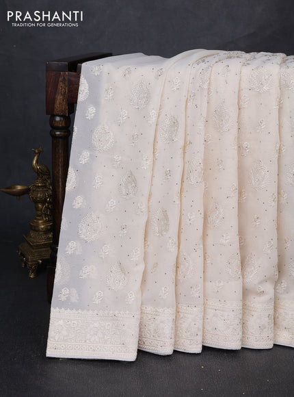 Georgette saree off white with allover embroidery buttas & stone work and embroidery & stone work border