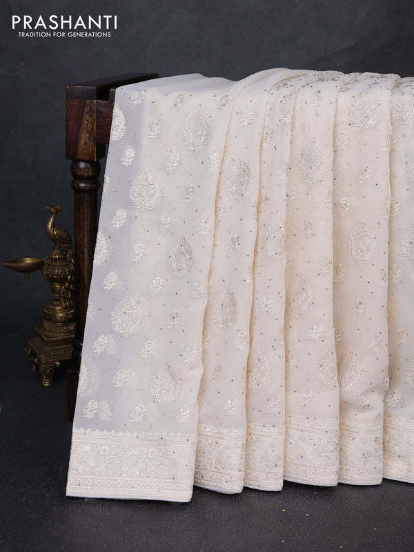 Georgette saree off white with allover embroidery buttas & stone work and embroidery & stone work border