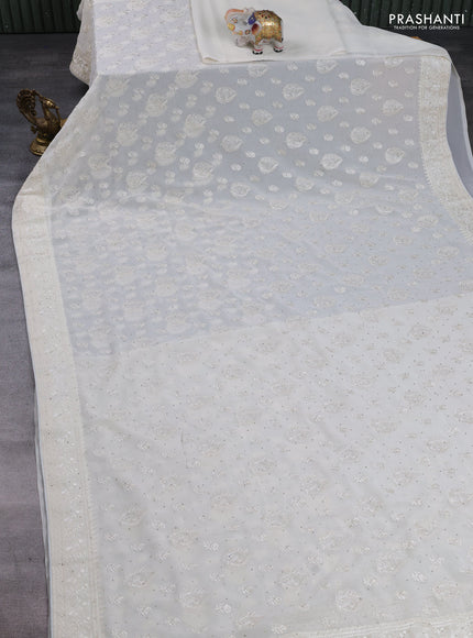 Georgette saree off white with allover embroidery buttas & stone work and embroidery & stone work border