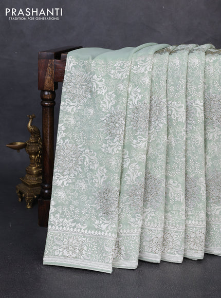 Georgette saree mild pista green with allover embroidery & stone work