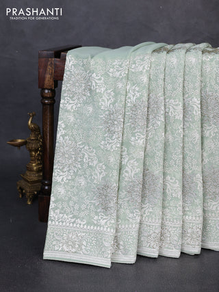 Georgette saree mild pista green with allover embroidery & stone work