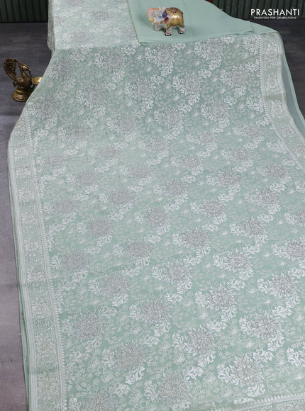 Georgette saree mild pista green with allover embroidery & stone work