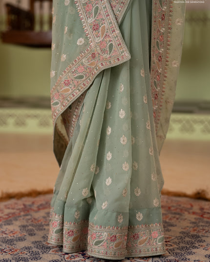 Georgette saree pastel green with allover embroidery buttas & stone work and embroidery & stone work border