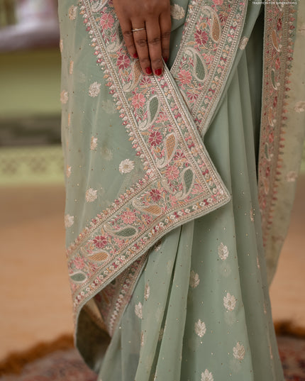 Georgette saree pastel green with allover embroidery buttas & stone work and embroidery & stone work border