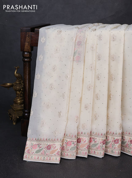 Georgette saree off white with allover embroidery buttas & stone work and embroidery & stone work border