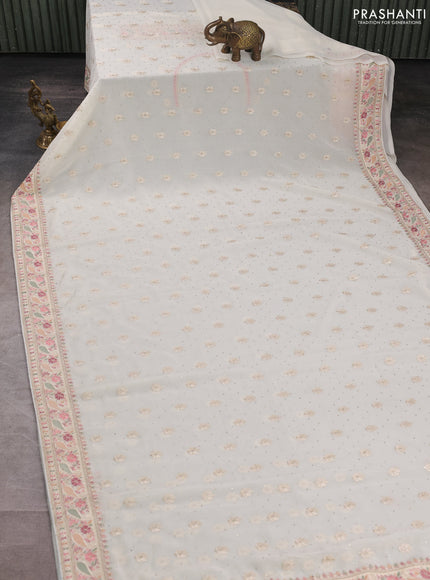Georgette saree off white with allover embroidery buttas & stone work and embroidery & stone work border