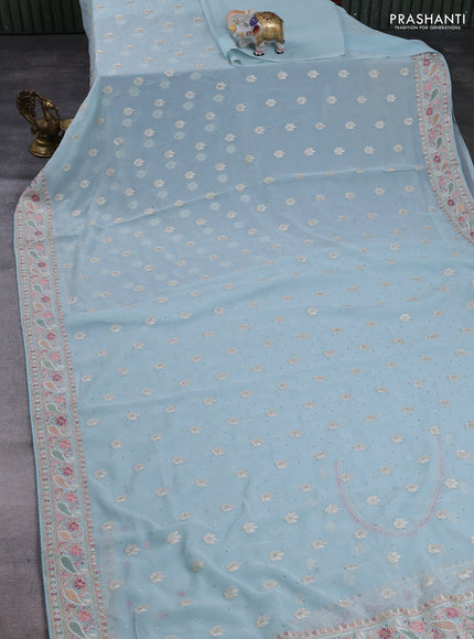 Georgette saree pastel blue with allover embroidery buttas & stone work and embroidery & stone work border