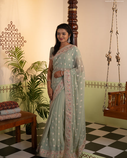 Georgette saree pastel green with allover embroidery buttas & stone work and embroidery & stone work border