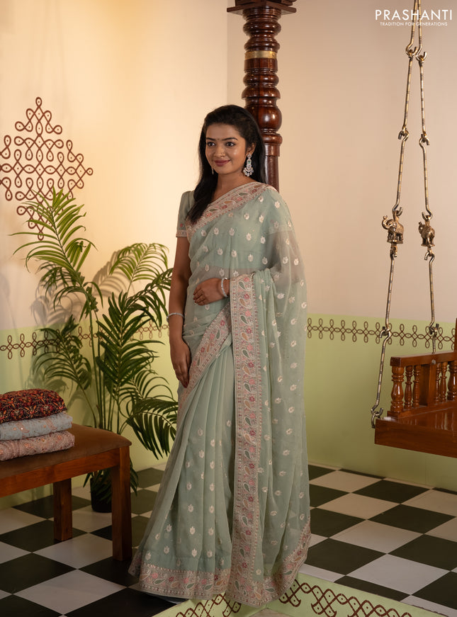 Georgette saree pastel green with allover embroidery buttas & stone work and embroidery & stone work border
