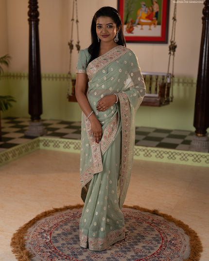 Georgette saree pastel green with allover embroidery buttas & stone work and embroidery & stone work border