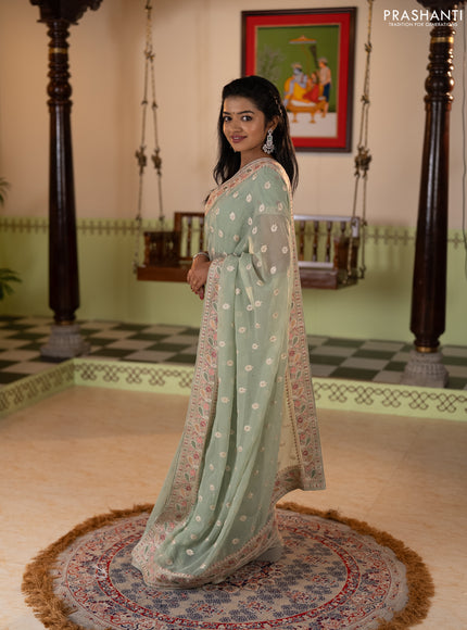 Georgette saree pastel green with allover embroidery buttas & stone work and embroidery & stone work border