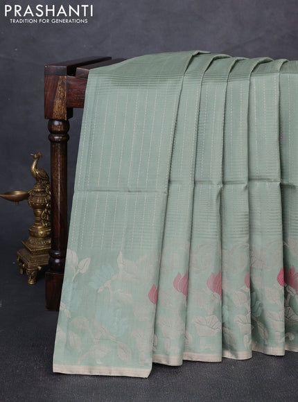 Pure soft silk saree pastel green with allover zari stripe pattern and floral zari woven border