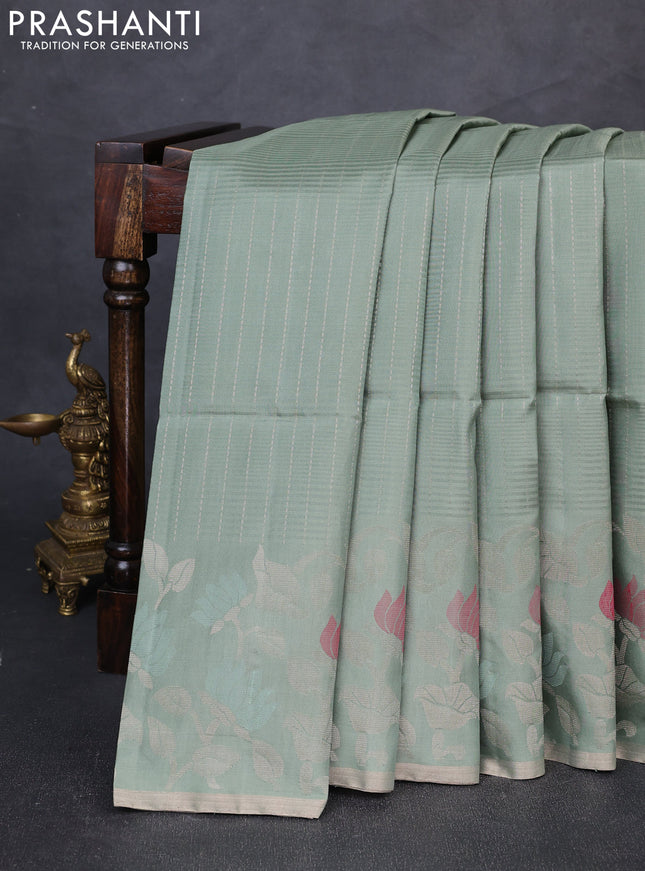 Pure soft silk saree pastel green with allover zari stripe pattern and floral zari woven border